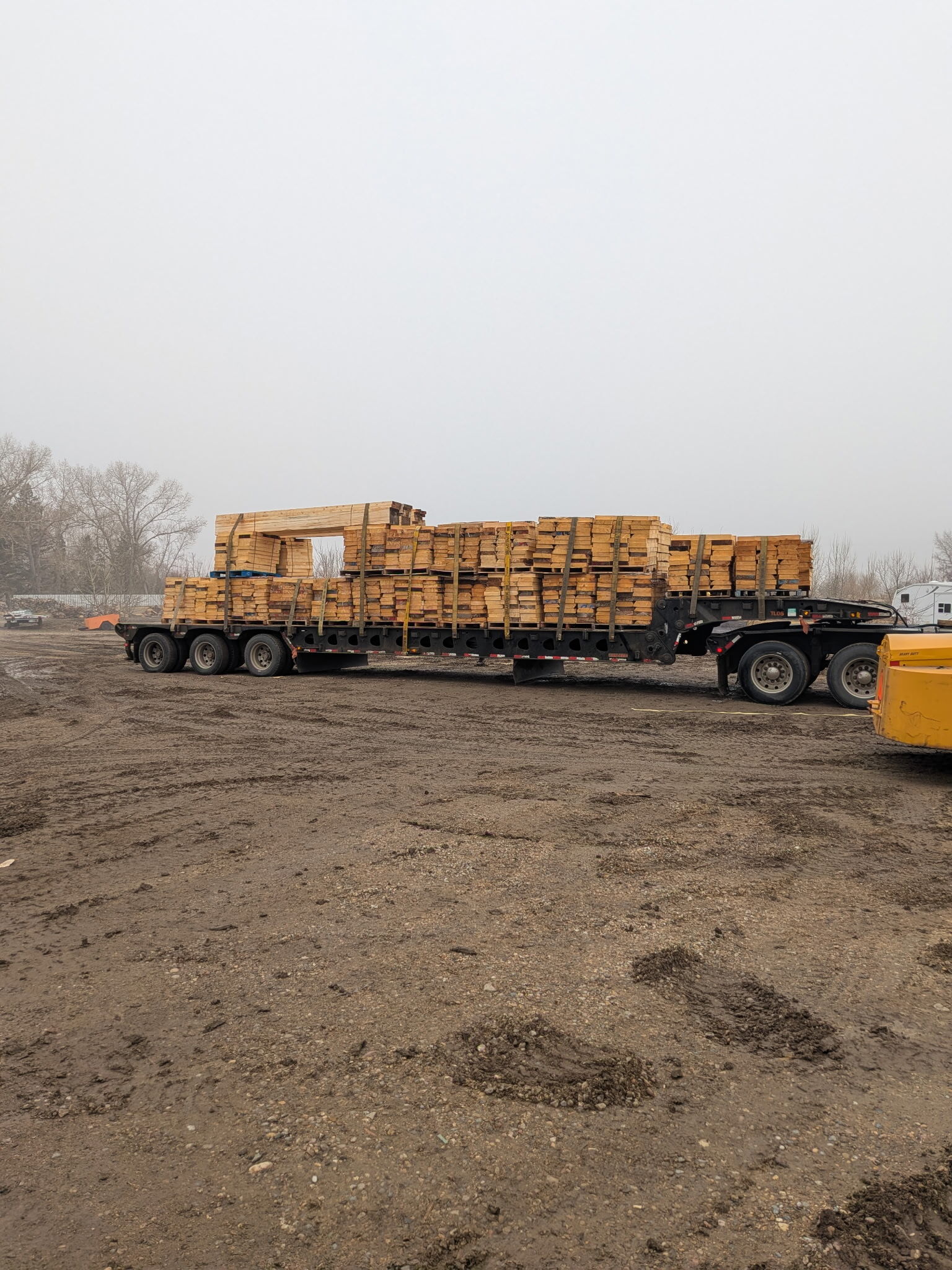lmentals wood delivery truck loaded with lumber